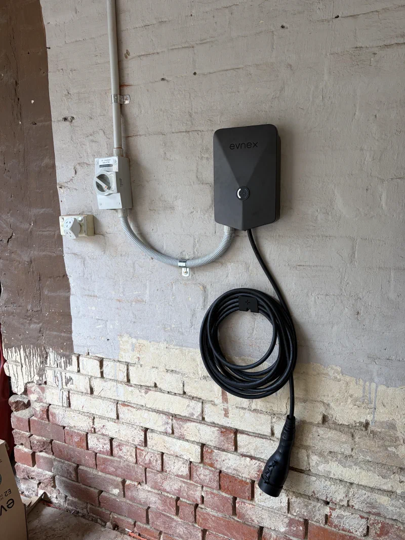 Wall-mounted Evnex charger with charging cable and isolator